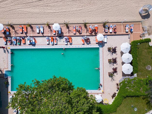 Aerial view of beautiful luxury outdoor swimming pool in hotel resort