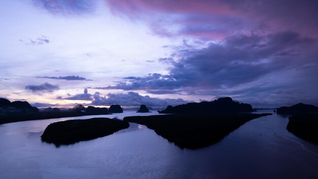 Aerial view of beautiful ocean against sky in the morning fog mist sunrise drone is flying over sea and mangrove forest Landscape High angle view