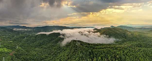 Aerial view, Beautiful Panorama landscape sunrise over peak Mountain with warm light sunrise Mae Moh Lampang, Thailand.