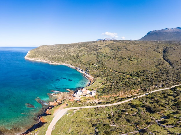 Aerial view beautiful water bay in the greek spectacular coast line Turquoise blue transparent water unique rocky cliffs Greece summer top travel destination Mani peninsula Peloponnese