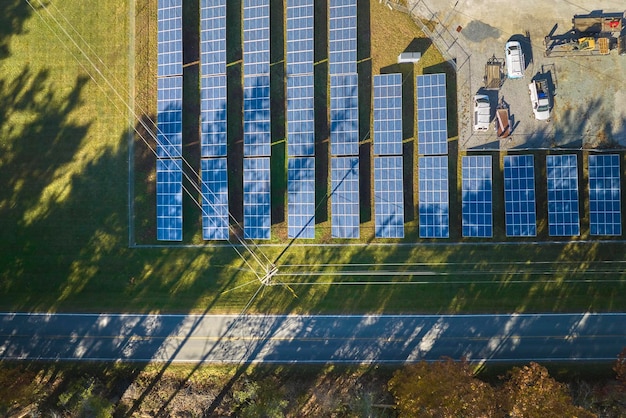 Aerial view of big sustainable electric power plant with many rows of solar photovoltaic panels