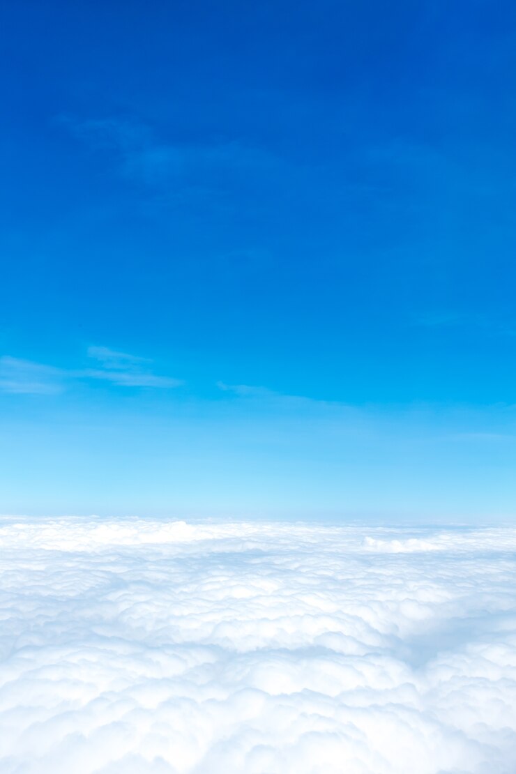 Photo aerial view of blue sky and cloud top view from airplane window