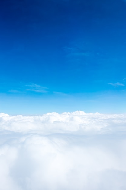 Aerial view of Blue sky and Cloud Top view from airplane window