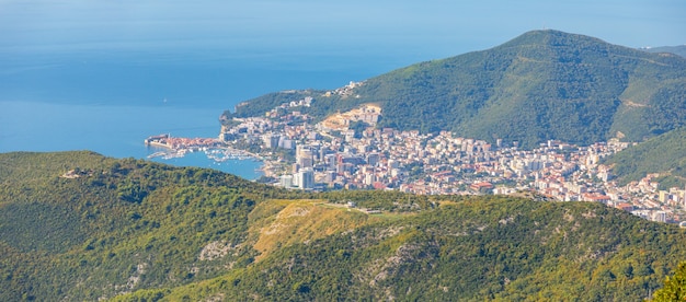 Aerial view of budva town in montenegro  panorama of adriatic coast and green mountains