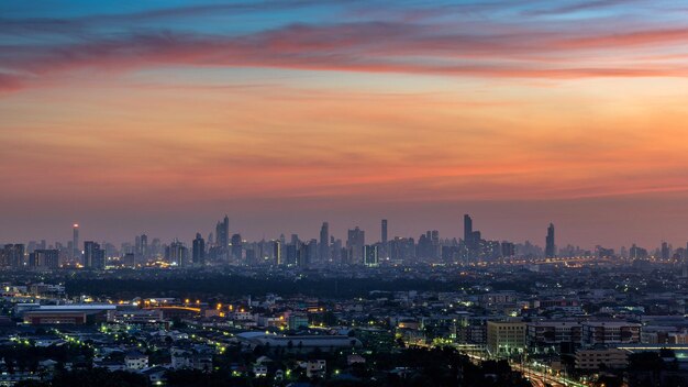 Photo aerial view of buildings in city against sky during sunset