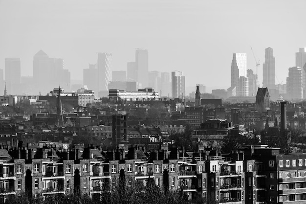 Photo aerial view of buildings in city against sky