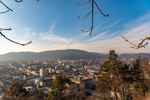 Aerial view of buildings in city against sky