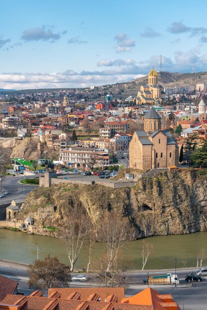 Aerial view of buildings in town against sky