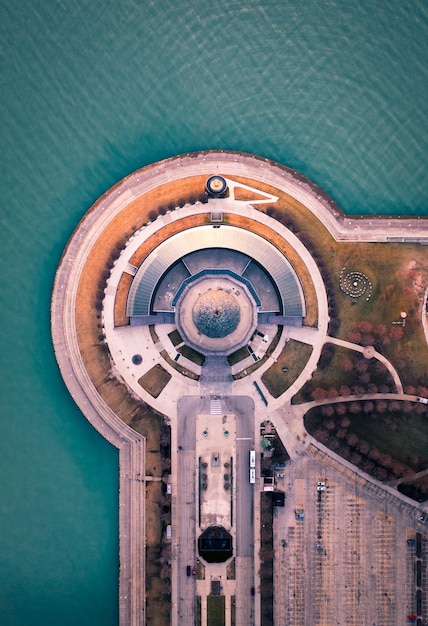 Aerial view of built structure by sea