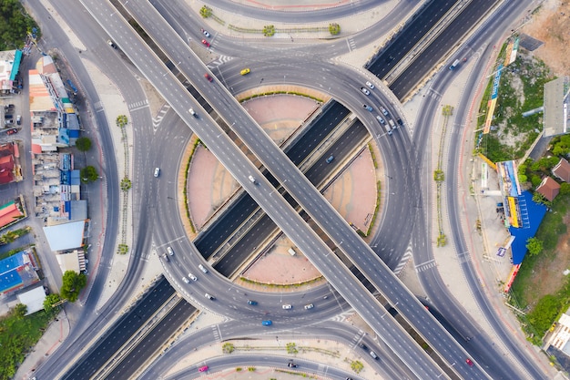 Aerial View Above of Busy Highway Road Junctions at day. The Intersecting Freeway Road Overpass The Eastern Outer Ring Road of Bangkok.