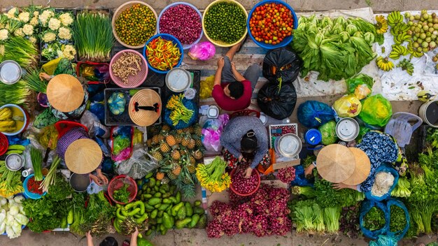 Aerial view of busy local daily life of the morning local market in vi thanh or chom hom market vietnam