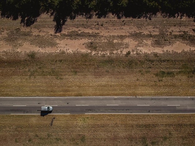 aerial view of car moving on road