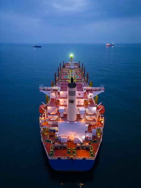 Aerial view cargo bulk carrier ship on the sea at night