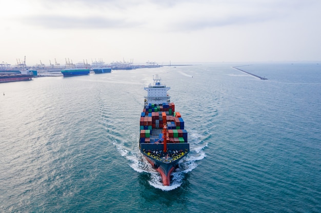 Aerial view cargo ship of business logistic transportation sea\
freight,cargo ship, cargo container in factory harbor at industrial\
estate for import export around in the world, trade port /\
shipping