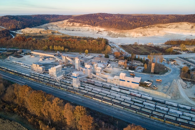 Aerial view of cargo train loaded with crushed sandstone materials at mine factory Railway transportation of open pit mining ore