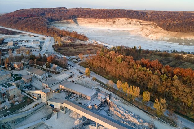 Aerial view of cargo train loaded with crushed sandstone\
materials at mine factory railway transportation of open pit mining\
ore