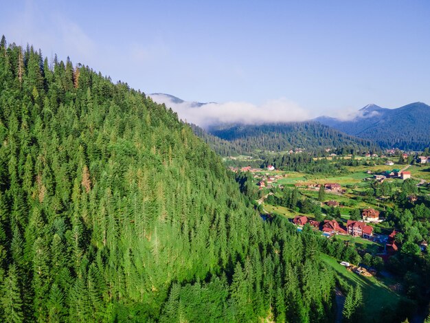 Aerial view of carpathian mountains range white clouds