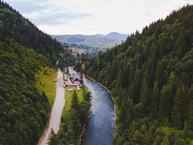 Aerial view of carpathian mountains with river summer time