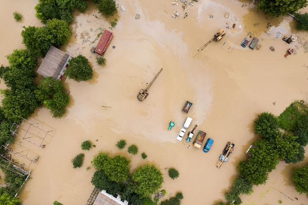 Aerial view of cars flooded with rain water.