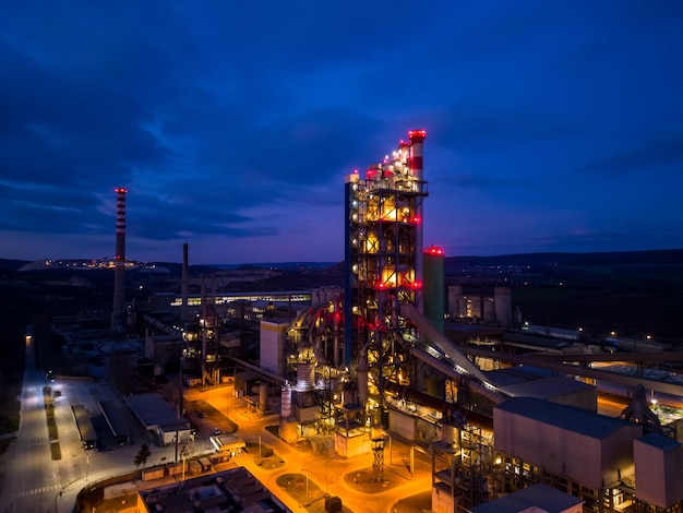 Aerial view of a cement factory at night industrial area