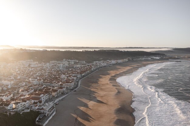 Aerial view of city against clear sky during sunset