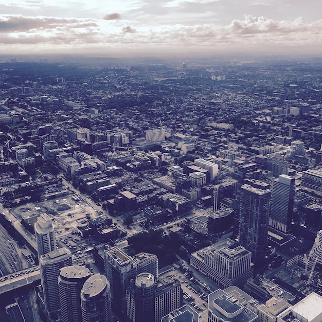 Photo aerial view of city buildings against sky