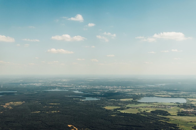 Aerial view of city and cloudy sky