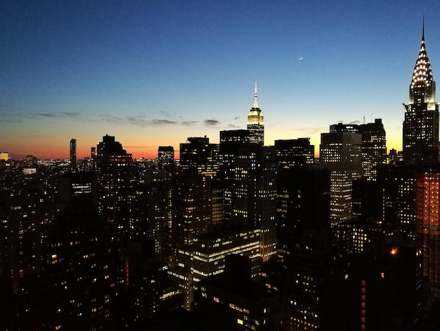 Aerial view of city lit up at night