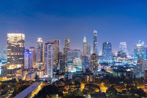 Aerial view of city lit up at night