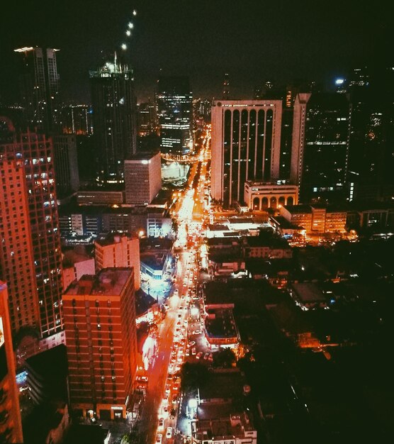 Aerial view of city lit up at night