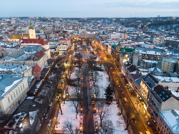 Aerial view of city in night time streets in car lights