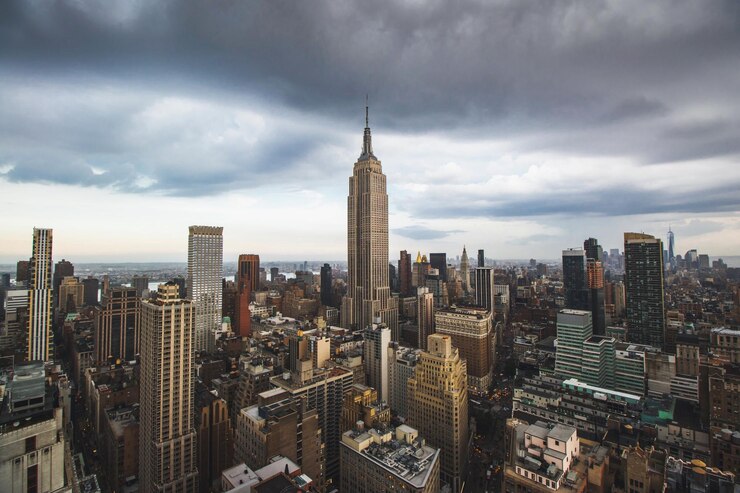 Photo aerial view of cityscape against cloudy sky
