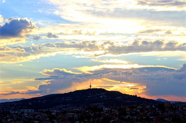 Aerial view of cityscape against sky during sunset