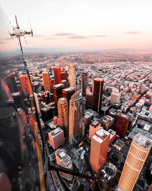 Photo aerial view of cityscape against sky during sunset