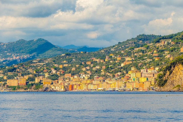 Aerial view of cityscape by sea against sky