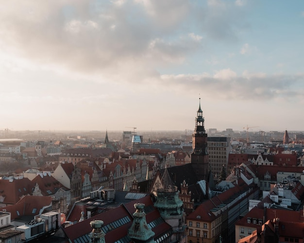 Aerial view of cityscape Wroclaw surrounded by buildings under cloudy sky