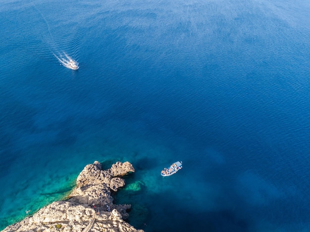 Aerial view of cliffs by the azure sea