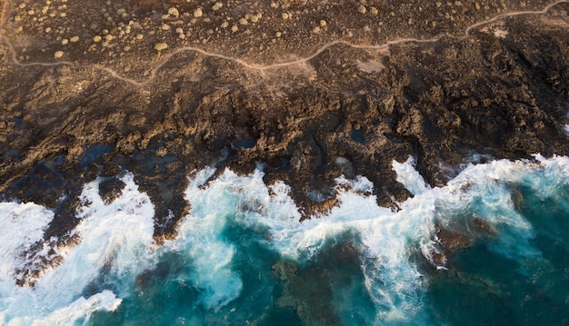 Aerial view of cliffs and foam of sea waves, Canary Islands