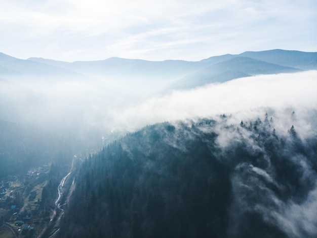 Aerial view of clods and fog over mountains hills magic time