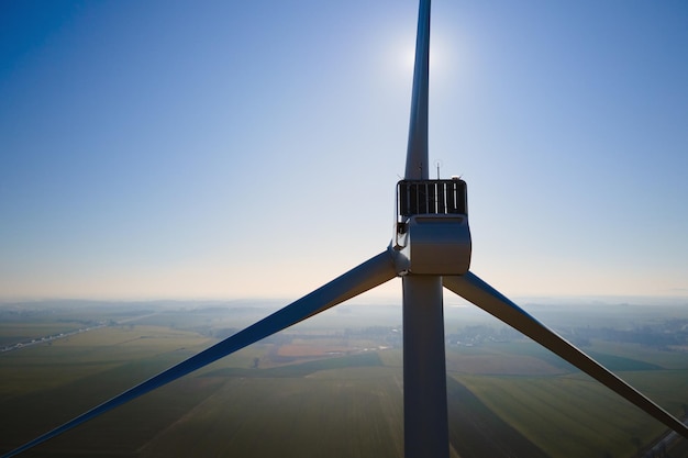 Aerial view of close up windmill turbine in countryside area