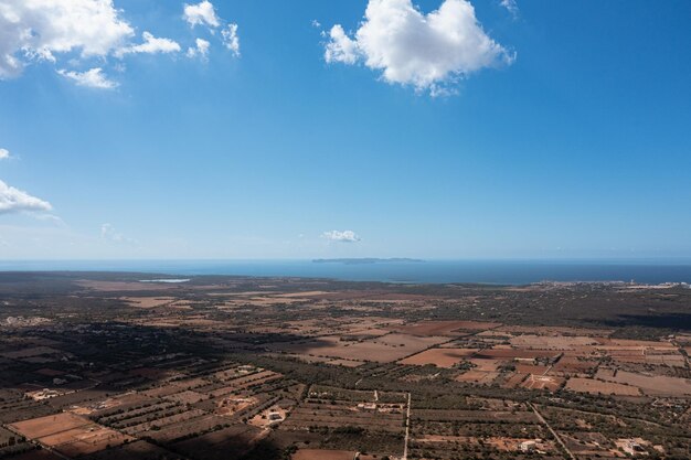 Aerial view of the clouds casting shadows over the country with the Mediterranean Sea on the back