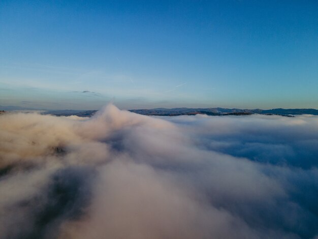 Aerial view above the clouds copy space