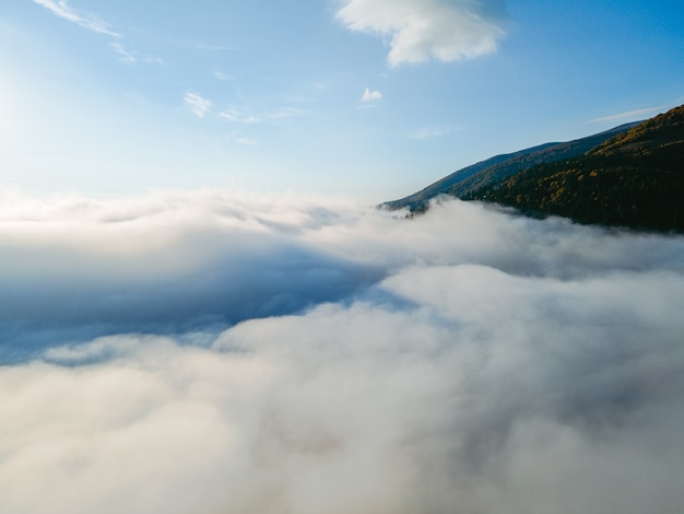 Aerial view above the clouds copy space