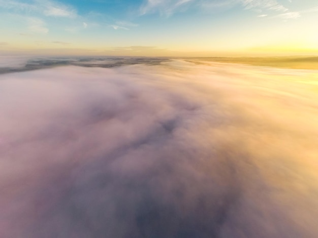 Photo aerial view of clouds during sunset