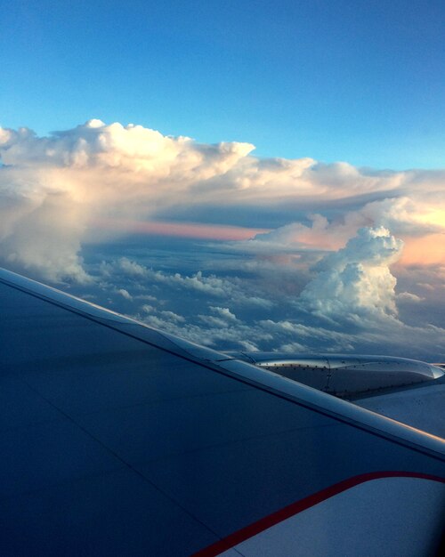 Aerial view of clouds seen through airplane window