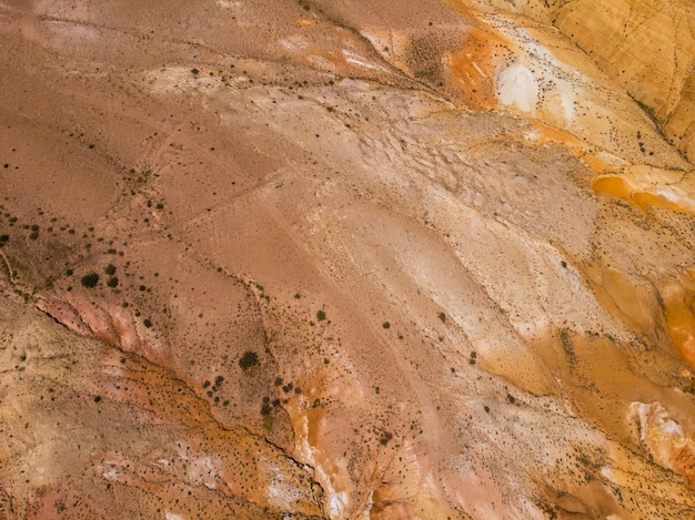 Aerial view of colorful eroded landform of Altai mountains in popular tourist location called Mars, Chagan-Uzun, Altai Republic, Russia