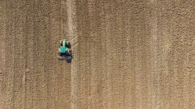 Aerial view of combine harvester. Rice Field Rural Brazilian Agriculture.