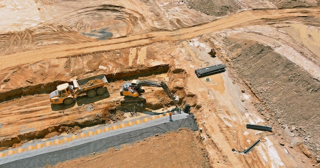 Aerial view of construction earn work in new residential buildings at work preparing ground