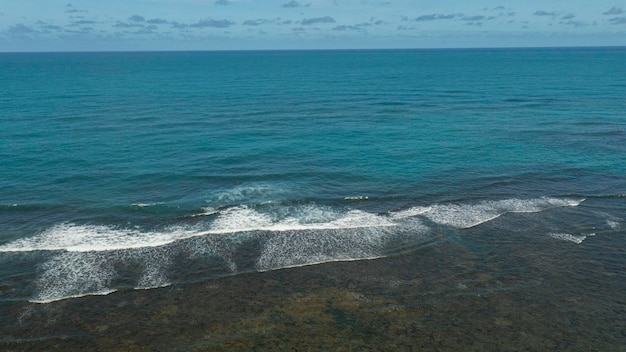 Aerial view of coral reefs and sea with blue water