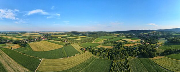 Aerial view of countryside area with village and mountains